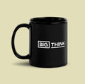 Black ceramic mug printed with the white "Big Think" logo.