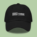 Black baseball cap embroidered with the white "Big Think" logo.