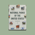 Hardcover logbook illustrated with travel-sticker-style badges for national parks.
